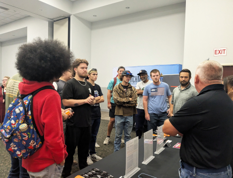 Students speaking with an employer at the career fair