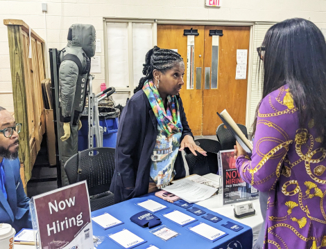 Photo of students speaking with employers at a previous career fair at the honeycutt center