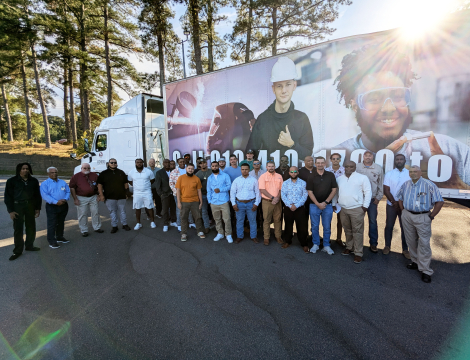 Group of CDL Graduates posing in front of the 18 wheeler truck