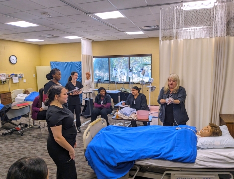 CNA Students working on a training mannikin 