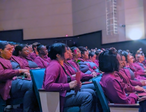 certified nursing assistant graduates sitting in the cole auditorium during the graduation ceremony 