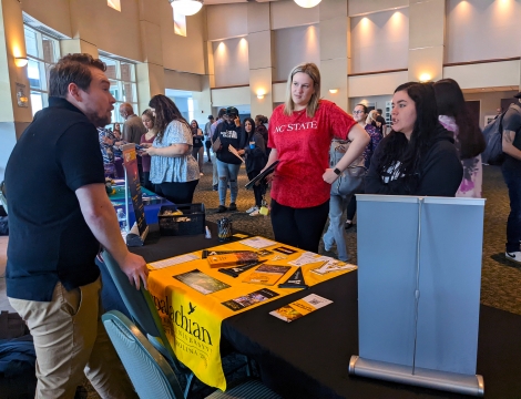 Students talking to college admissions reps