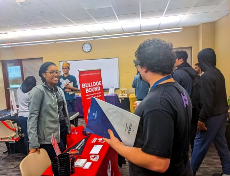 students speaking to advisor at college transfer fair