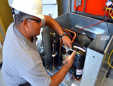 man working on a hvac unit