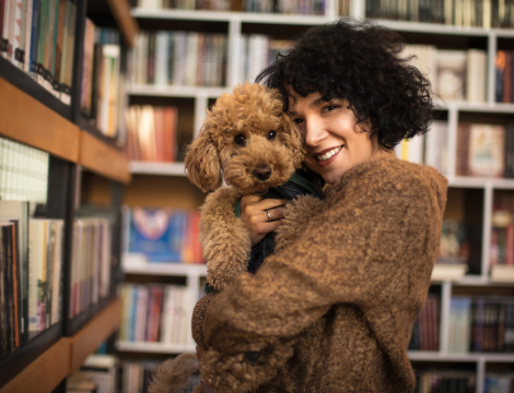Woman holding a poodle