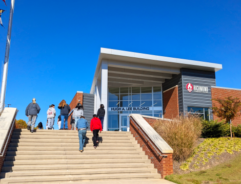 Students climb the steps of the Lee Building