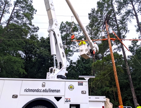 Lineman students in the bucket truck