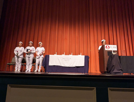 Photo of a previous LPN Graduation on stage at the Cole Auditorium