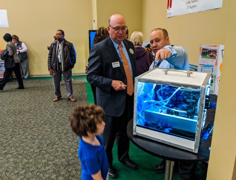 Child staring at a computer display