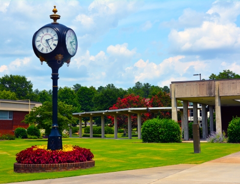 Picture of the campus with the clock in the foreground