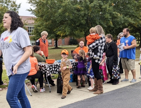 Kids dressed in halloween costumes participating in Trick or Treak to the Trail