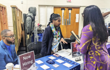 Photo of students speaking with employers at a previous career fair at the honeycutt center