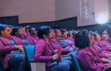 certified nursing assistant graduates sitting in the cole auditorium during the graduation ceremony 