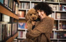 Woman holding a poodle