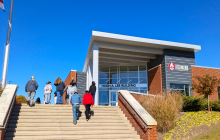 Students climb the steps of the Lee Building