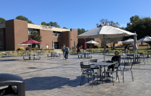 Students sit outside the Cafe