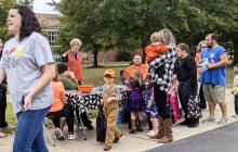 Kids dressed in halloween costumes participating in Trick or Treak to the Trail