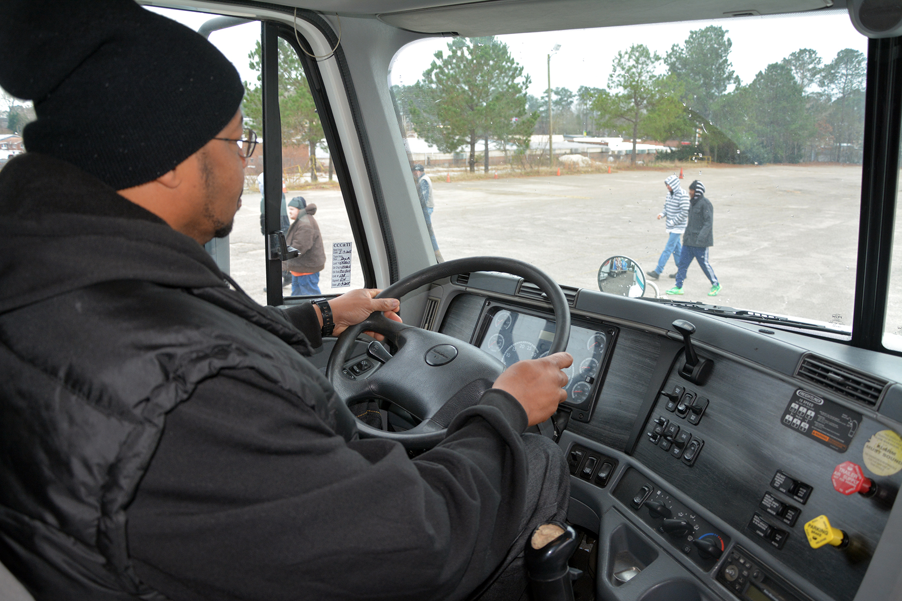 Getting the feel of being behind the wheel of an 18-wheeler, a student in the truck driver training class at Richmond Community College takes what he learned in the classroom to the hands-on practice in the driver seat.  RichmondCC is now accepting students into the fall truck driver training program that will begin Sept. 12.
